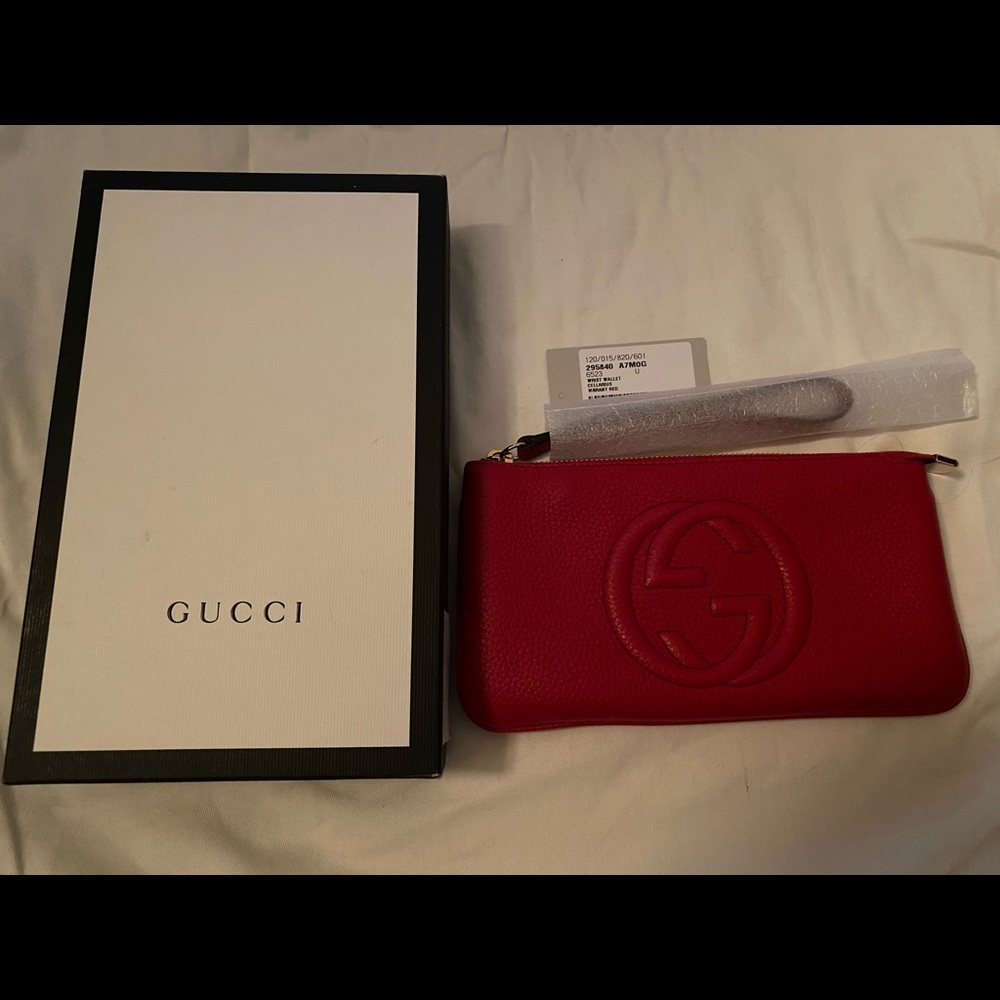 Authentic Gucci Wrist wallet in Red.